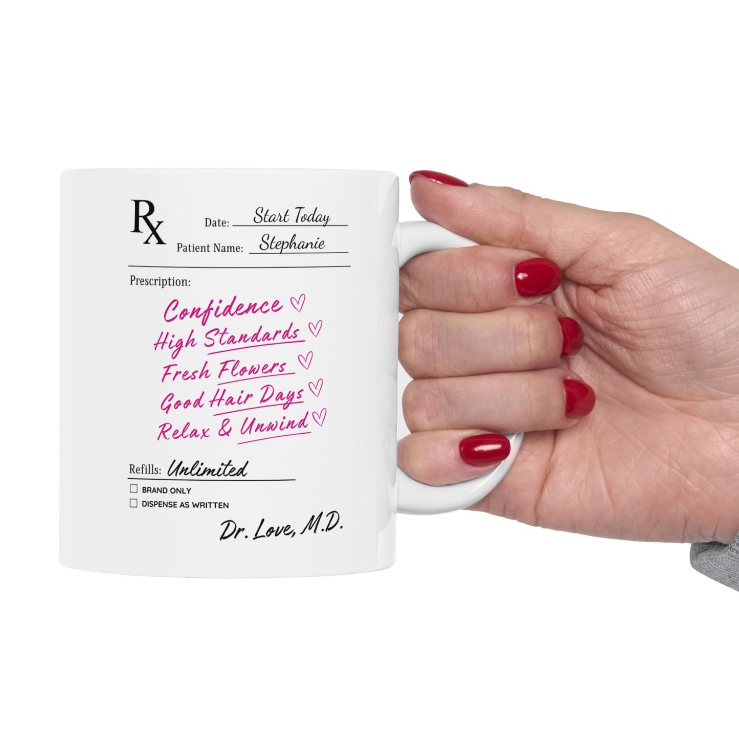 Hand holding a mug with personalized text on a white background
