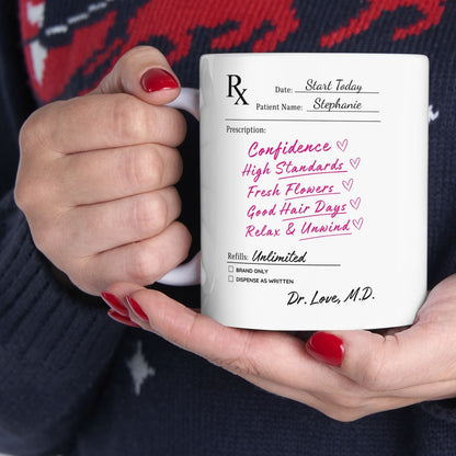 Person holding a mug with a personalized prescription design against a dark sweater with red deer pattern.