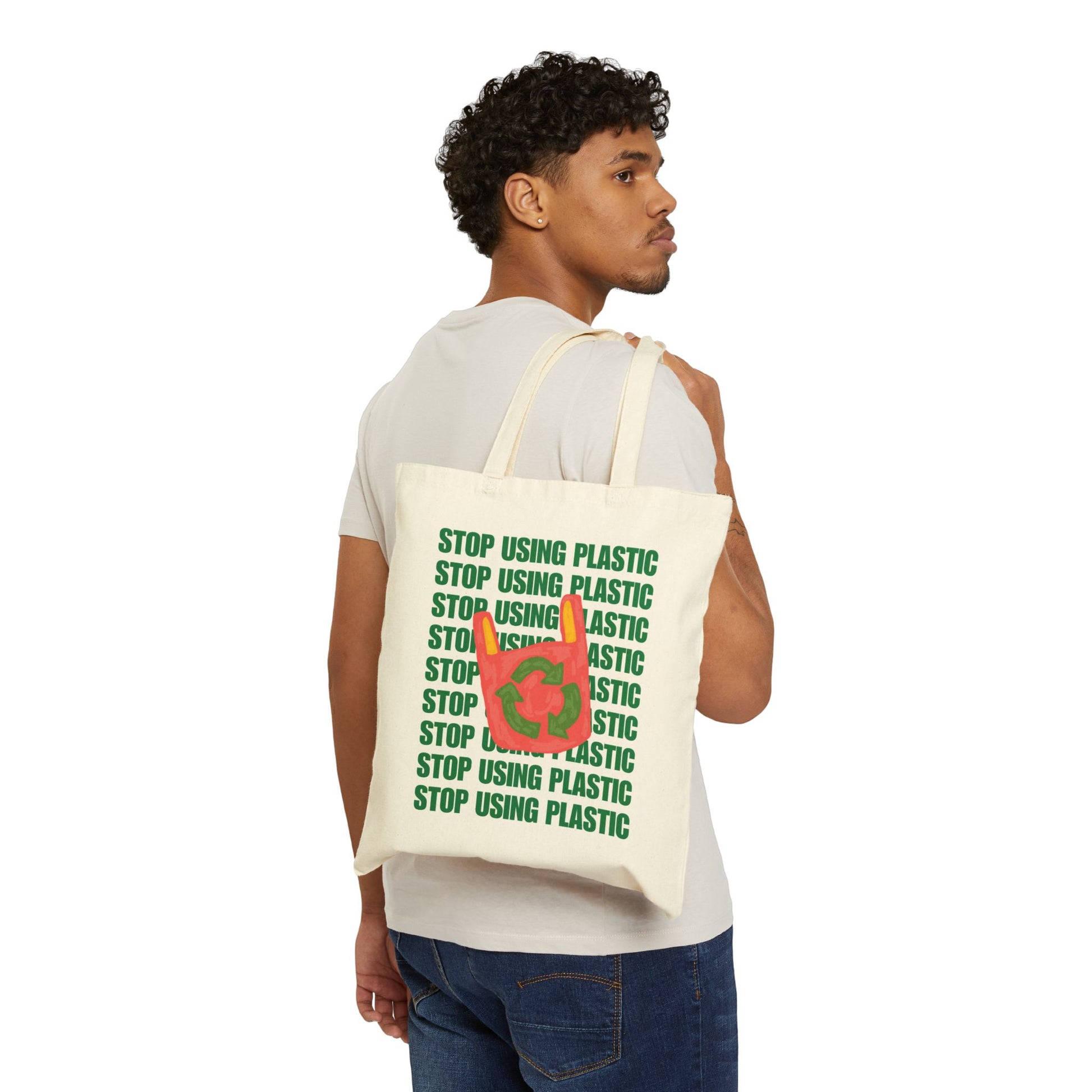 Person holding a tote bag with a frog design and 'Toad Sage' text on a white background