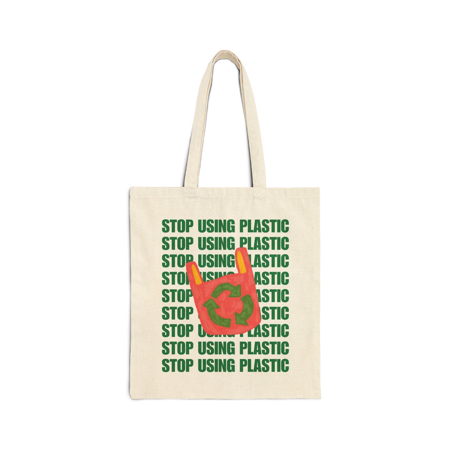 An off-white canvas tote bag with green text reading 'STOP USING PLASTIC' repeated vertically, overlaid with a red plastic bag graphic containing the green recycling symbol.