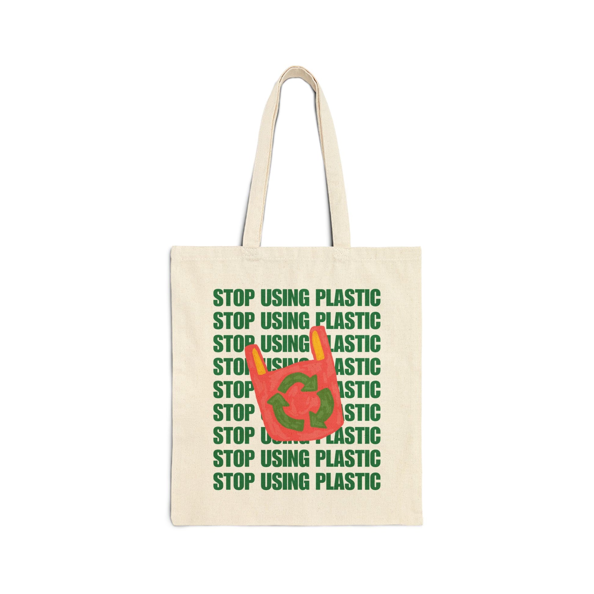 An off-white canvas tote bag with green text reading 'STOP USING PLASTIC' repeated vertically, overlaid with a red plastic bag graphic containing the green recycling symbol.
