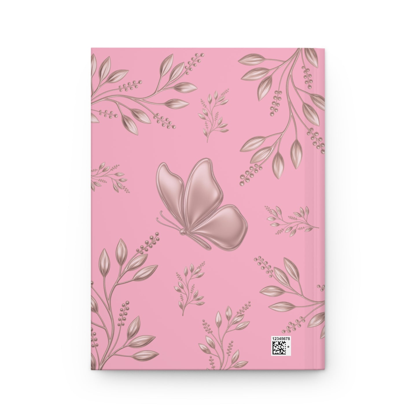 A pink notebook with a repeating pattern of metallic rose-gold leaves and a large rose-gold butterfly on the cover, shown against a plain white background.